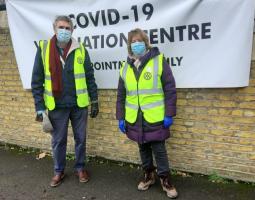 Kingston upon Thames Rotarians Paul & Christine voluteering at a Vaccine centre 